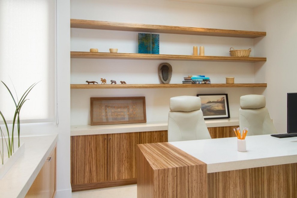 Mid-sized trendy built-in desk limestone floor home office photo in San Diego
