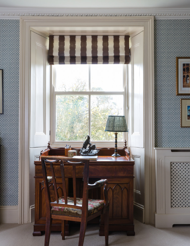 Photo of a small classic study in London with carpet, a freestanding desk and beige floors.