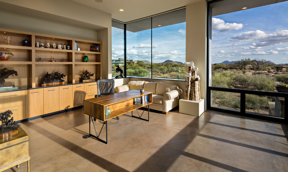 Home office - contemporary freestanding desk concrete floor and gray floor home office idea in Other with white walls