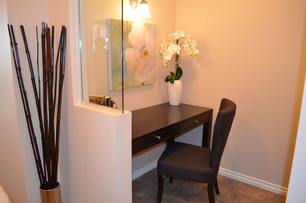 Example of a trendy home office design in Calgary