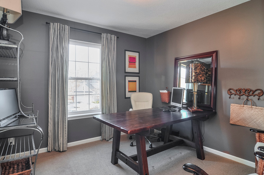 Example of a small classic freestanding desk carpeted study room design in Kansas City with gray walls and no fireplace