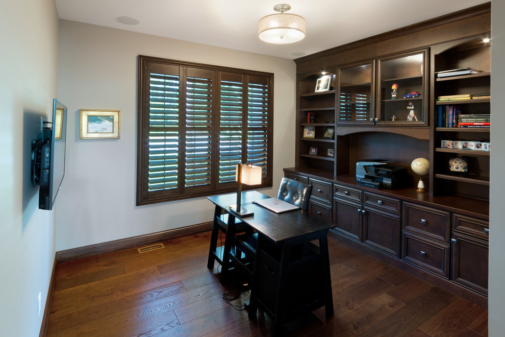 Example of a transitional home office design in Other
