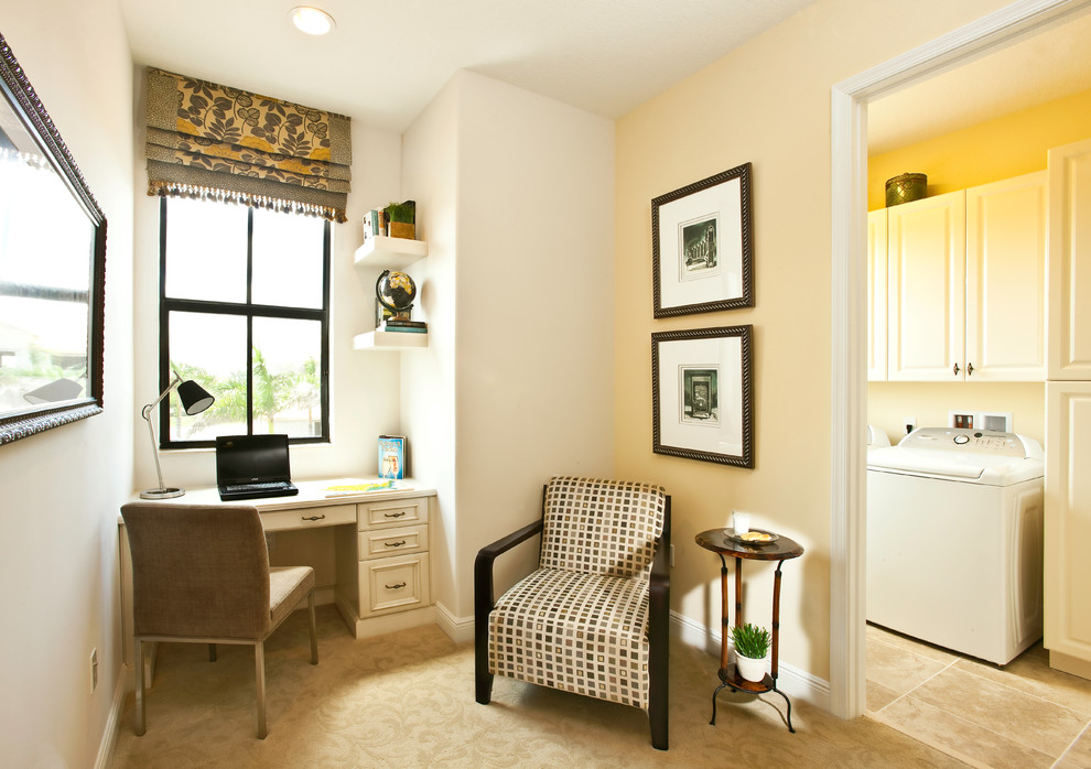 Inspiration for a mid-sized timeless ceramic tile home office remodel in Miami with beige walls
