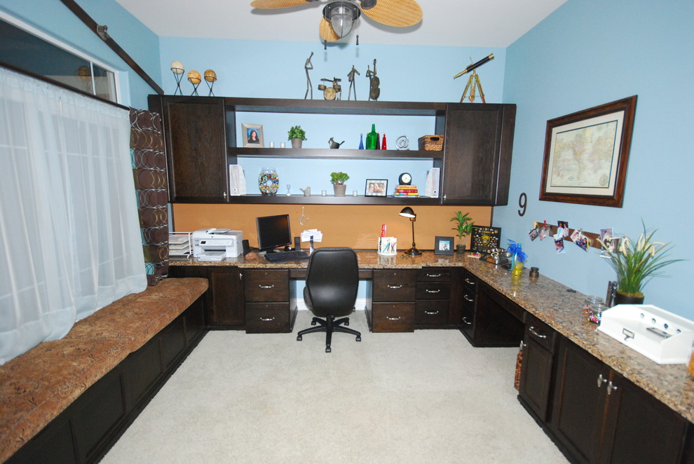 Design ideas for a medium sized traditional home office in Other with blue walls and carpet.