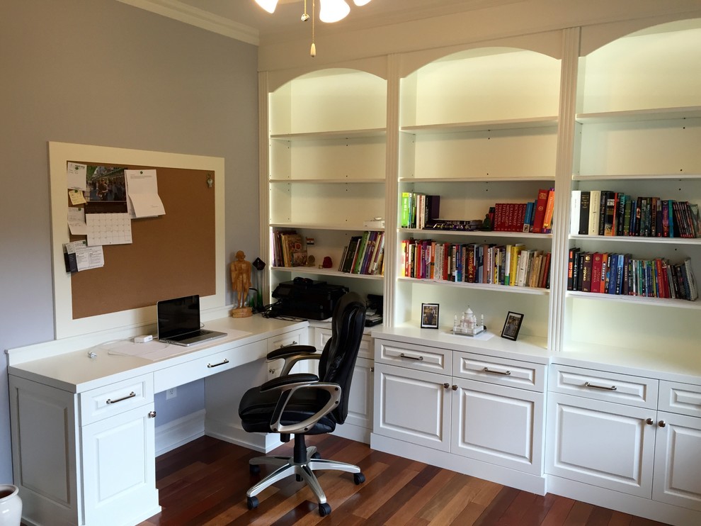 Study room - mid-sized traditional freestanding desk dark wood floor and brown floor study room idea in New York with gray walls and no fireplace
