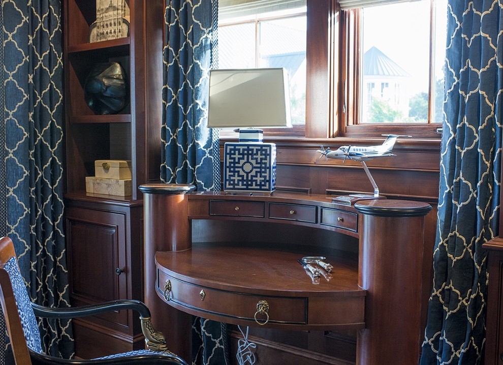 This is an example of a large traditional home office in Charleston with a reading nook, dark hardwood flooring, no fireplace and a built-in desk.