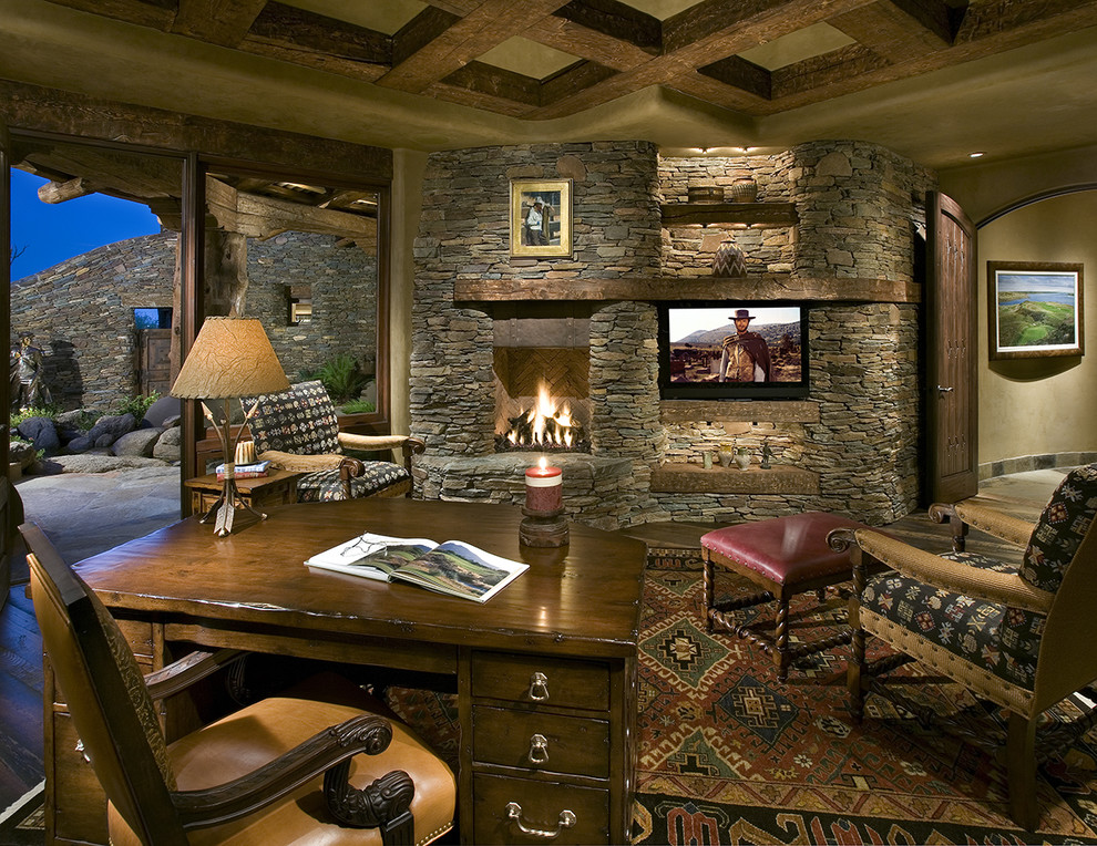 Example of a southwest home office design in Phoenix with a stone fireplace and a corner fireplace