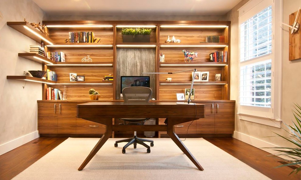 Example of a mid-sized trendy freestanding desk dark wood floor study room design in DC Metro with gray walls and no fireplace
