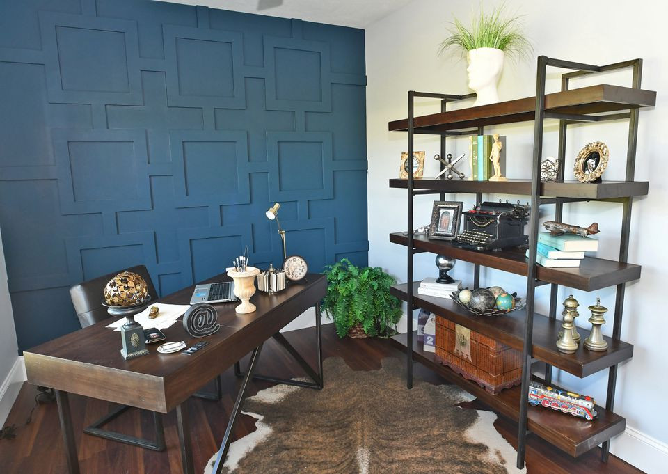 Inspiration for a mid-sized craftsman freestanding desk laminate floor and brown floor study room remodel in New York with multicolored walls