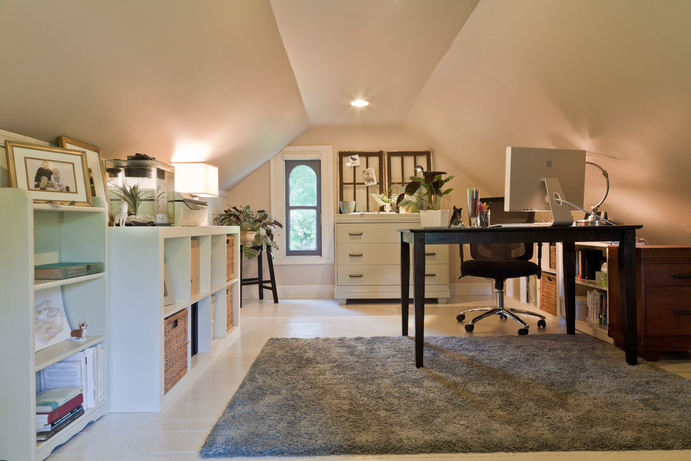 This is an example of a medium sized classic study in Philadelphia with beige walls, painted wood flooring, no fireplace, a freestanding desk and white floors.