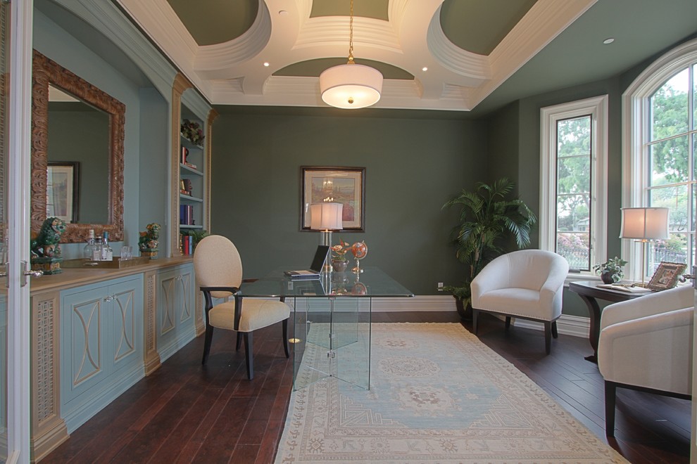 Example of a large transitional freestanding desk dark wood floor study room design in Los Angeles with green walls and no fireplace