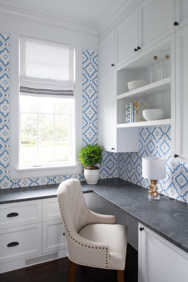 Inspiration for a small transitional built-in desk dark wood floor and brown floor study room remodel in Minneapolis with blue walls and no fireplace