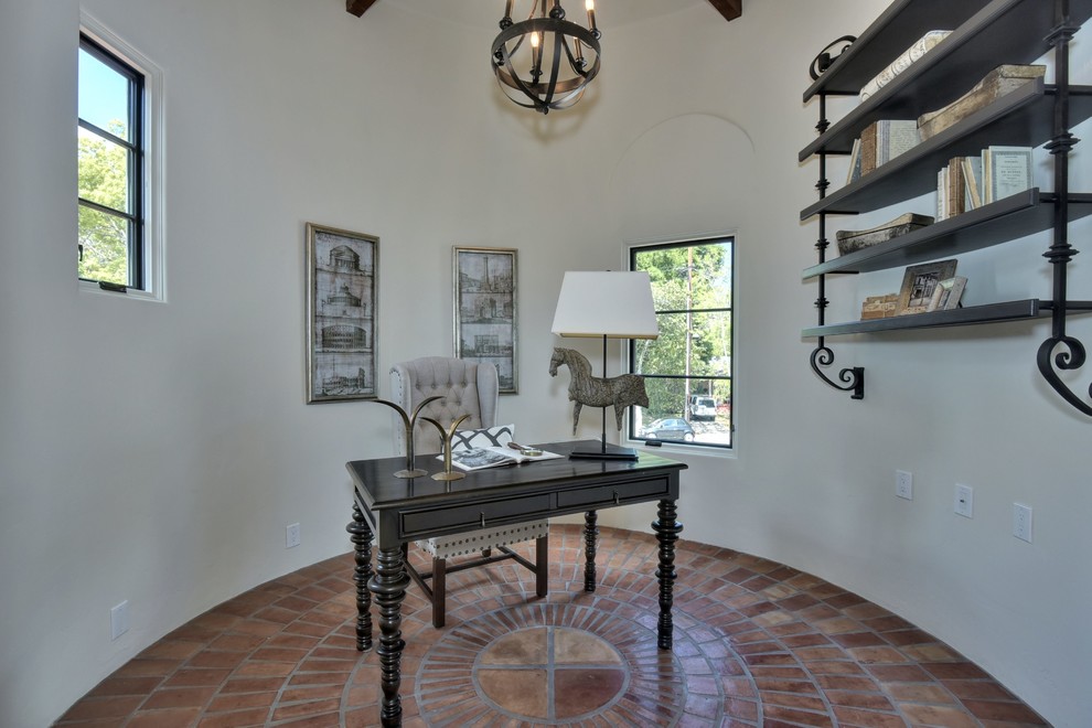 Inspiration for a medium sized mediterranean study in San Francisco with white walls, terracotta flooring, a freestanding desk and no fireplace.