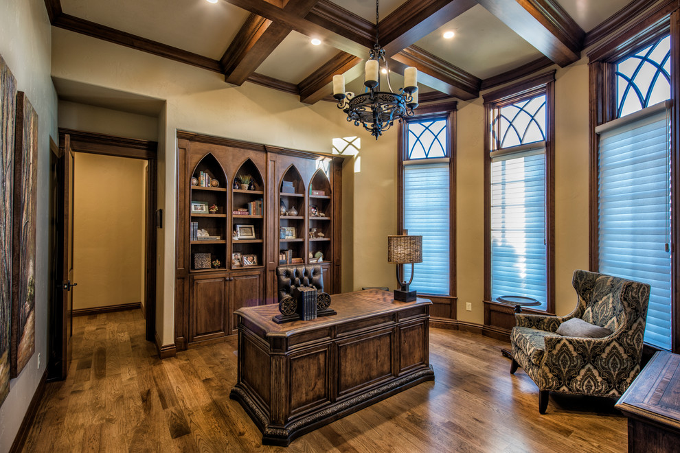 Small traditional study in Other with a freestanding desk, beige walls, dark hardwood flooring and no fireplace.