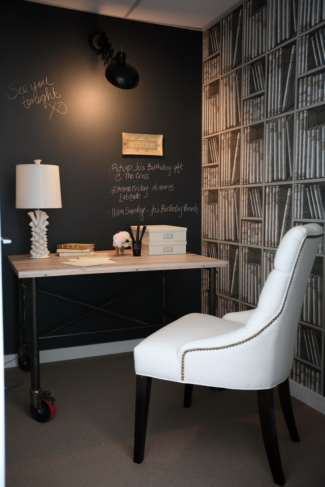 Inspiration for a timeless freestanding desk carpeted home office remodel in Vancouver with black walls