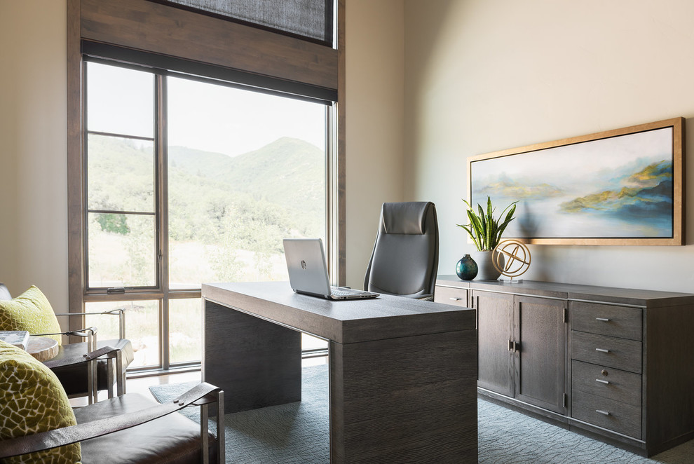 Inspiration for a rustic study in Salt Lake City with beige walls and a freestanding desk.