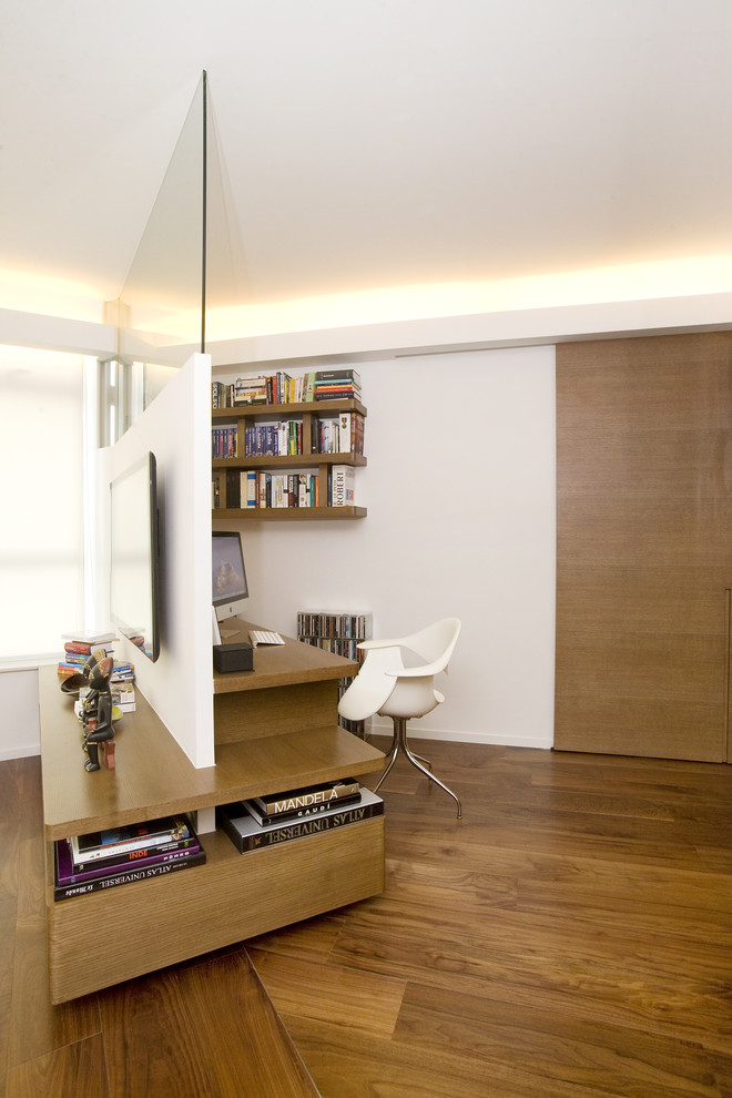 Example of a trendy home office design in Hong Kong with white walls