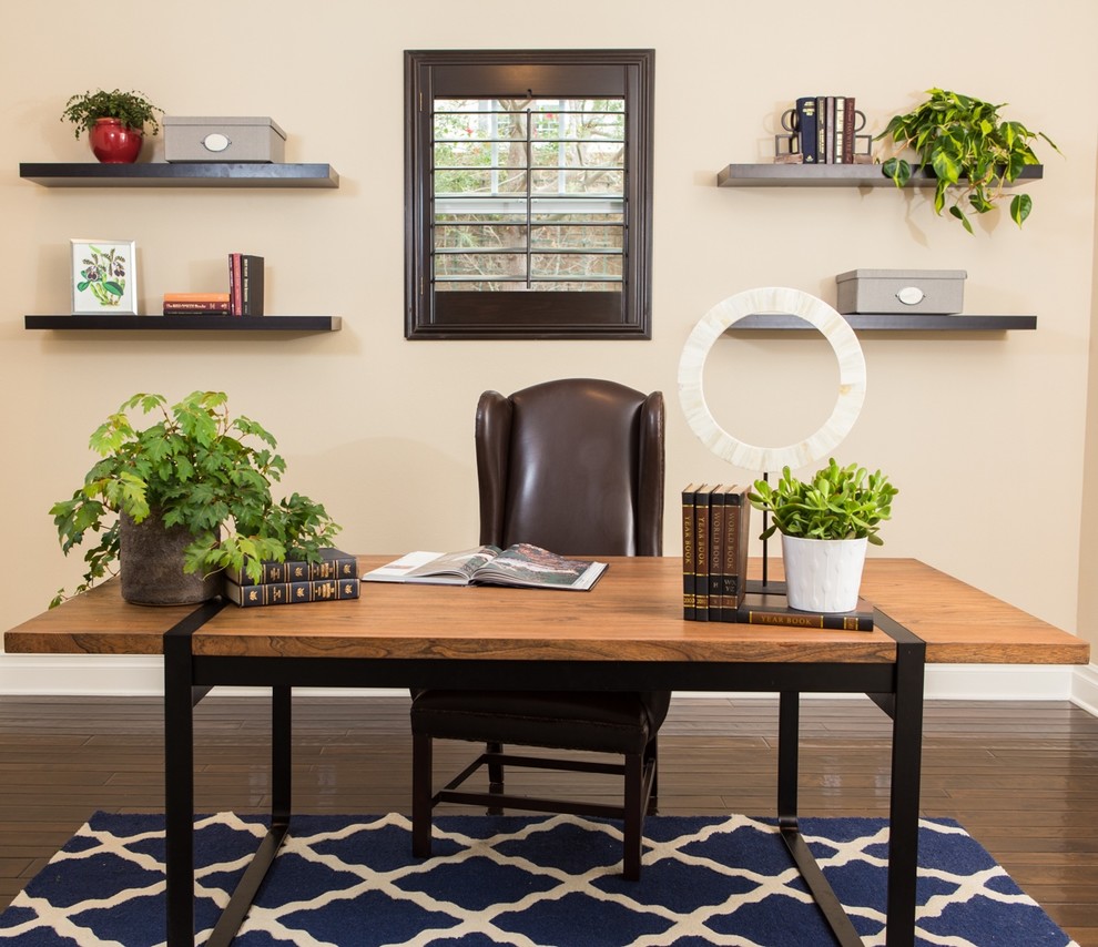 Photo of a classic home office in Orange County with beige walls, dark hardwood flooring and a freestanding desk.