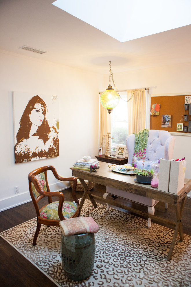 Home office - eclectic freestanding desk dark wood floor home office idea in Los Angeles with white walls