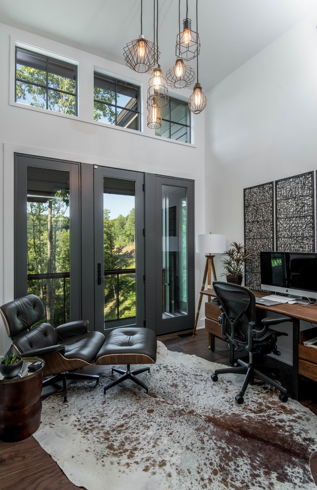 Inspiration for a rustic freestanding desk dark wood floor study room remodel in Other with white walls