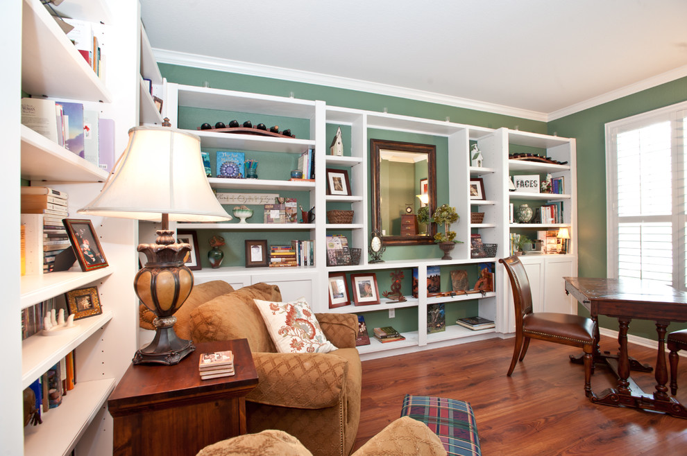 Medium sized classic study in Austin with green walls, medium hardwood flooring, no fireplace and a freestanding desk.
