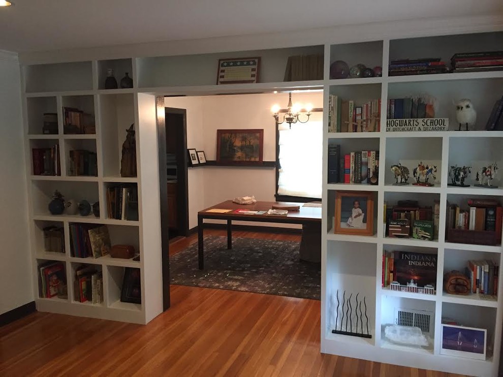 Home office library - mid-sized traditional freestanding desk light wood floor home office library idea in Indianapolis with white walls and no fireplace