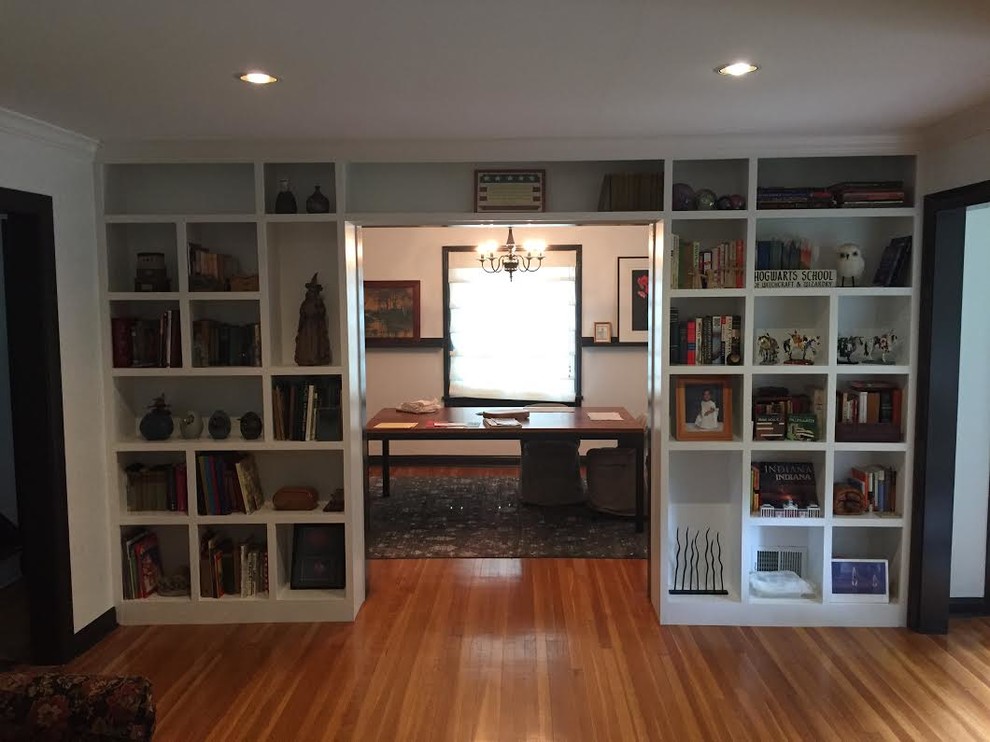 Inspiration for a mid-sized timeless freestanding desk light wood floor home office library remodel in Indianapolis with white walls and no fireplace