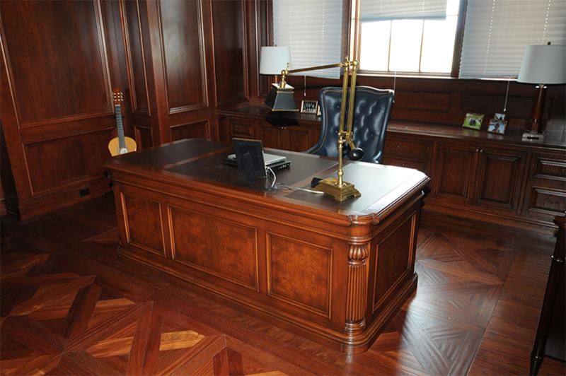 Large elegant freestanding desk dark wood floor home office photo in Salt Lake City
