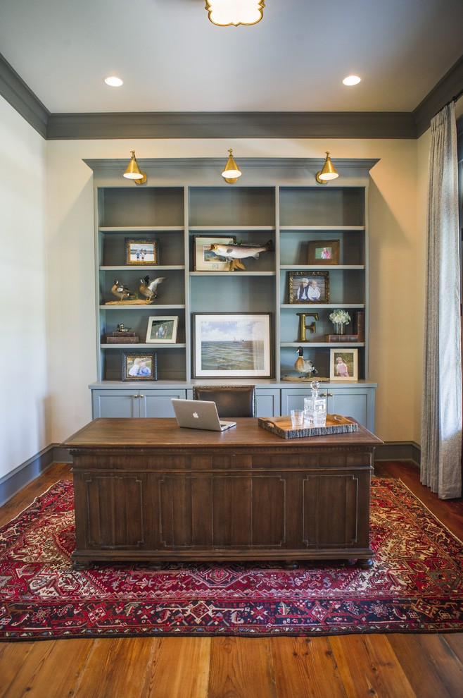 Inspiration for a large timeless freestanding desk medium tone wood floor and brown floor study room remodel in Houston with white walls and no fireplace