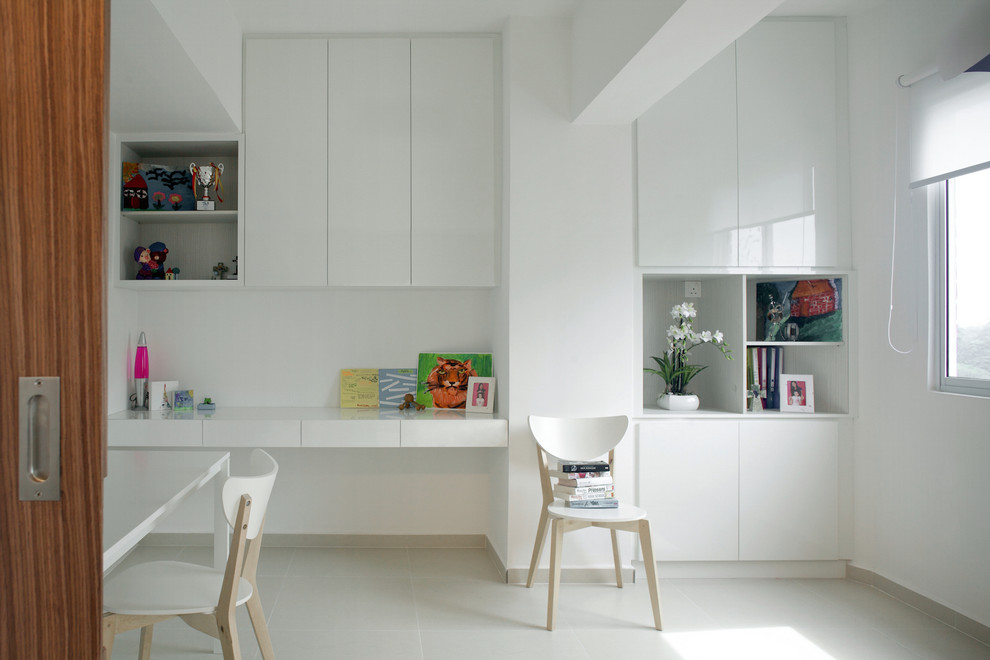 Inspiration for a mid-sized modern built-in desk study room remodel in Singapore