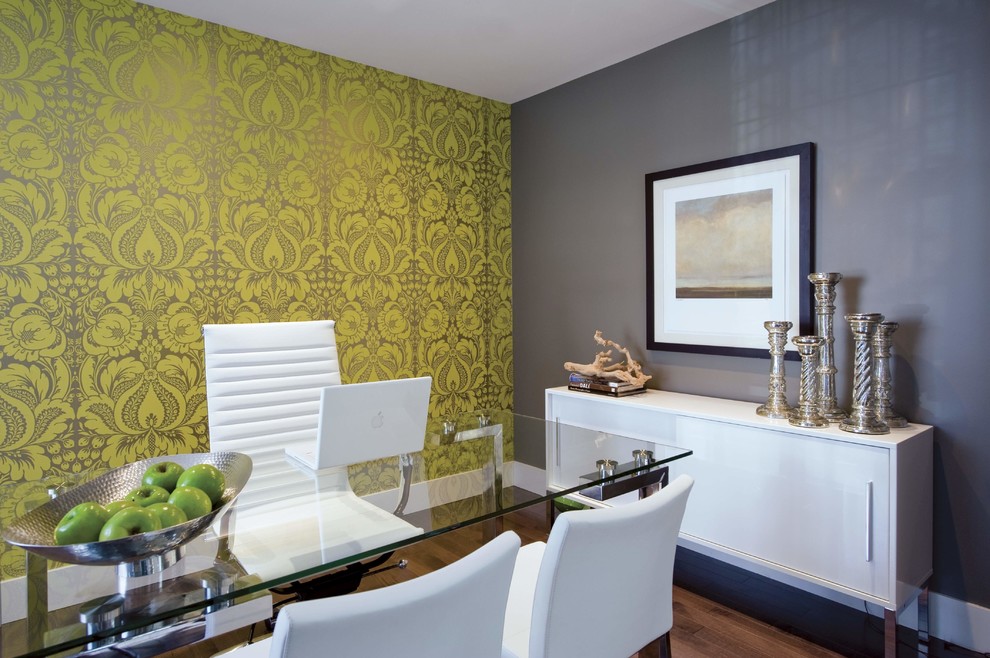 Eclectic freestanding desk dark wood floor home office photo in Calgary with gray walls
