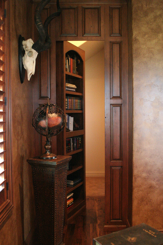 This is an example of a medium sized classic study in Boise with beige walls, a freestanding desk, dark hardwood flooring, no fireplace and brown floors.