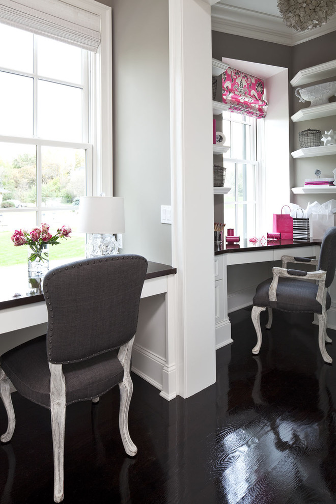 Example of a mid-sized classic built-in desk painted wood floor and black floor home office design in Minneapolis with no fireplace and gray walls
