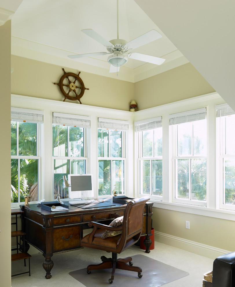 Inspiration for a mid-sized coastal freestanding desk carpeted study room remodel in Tampa