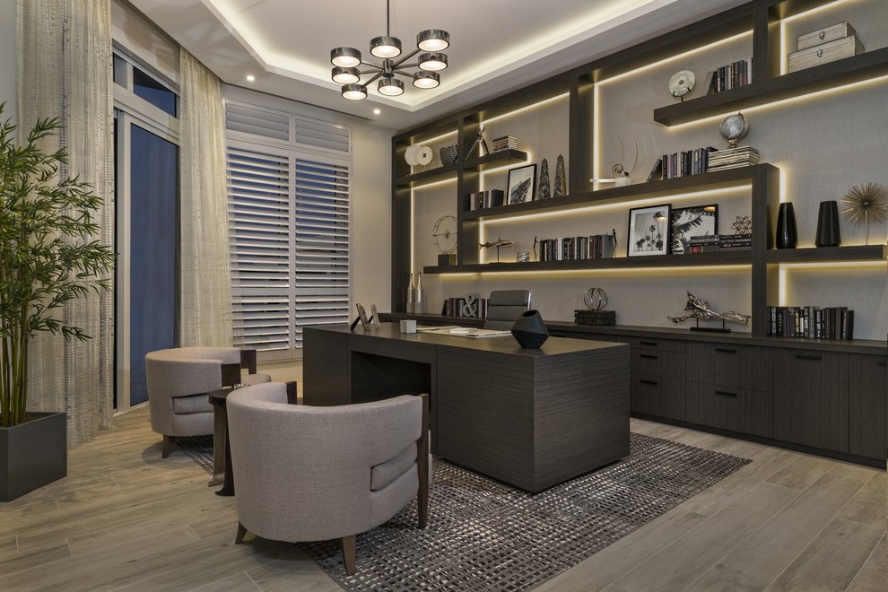 Inspiration for a large contemporary home office in Miami with grey walls and ceramic flooring.