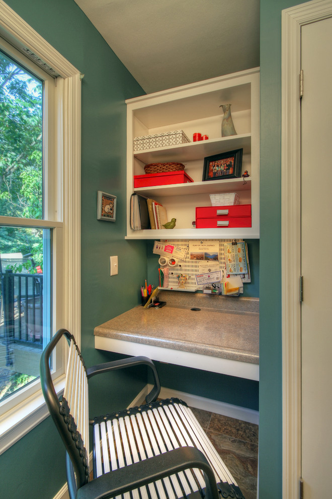 Home office - small contemporary built-in desk carpeted home office idea in St Louis with blue walls