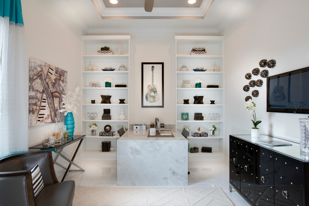 Example of a trendy built-in desk study room design in Miami with white walls
