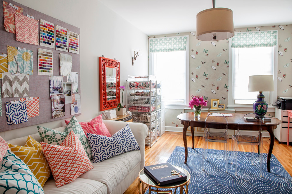 Inspiration for an eclectic freestanding desk medium tone wood floor home office remodel in Philadelphia with white walls