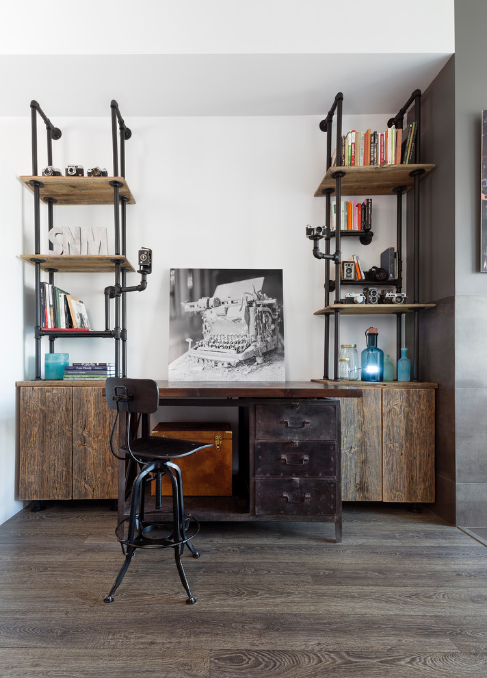 Home studio - industrial freestanding desk medium tone wood floor home studio idea in Toronto with white walls