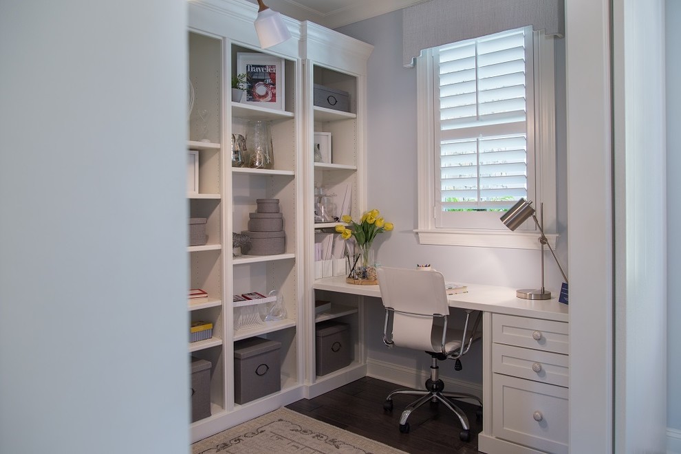 Example of a transitional home office design in San Francisco with white walls