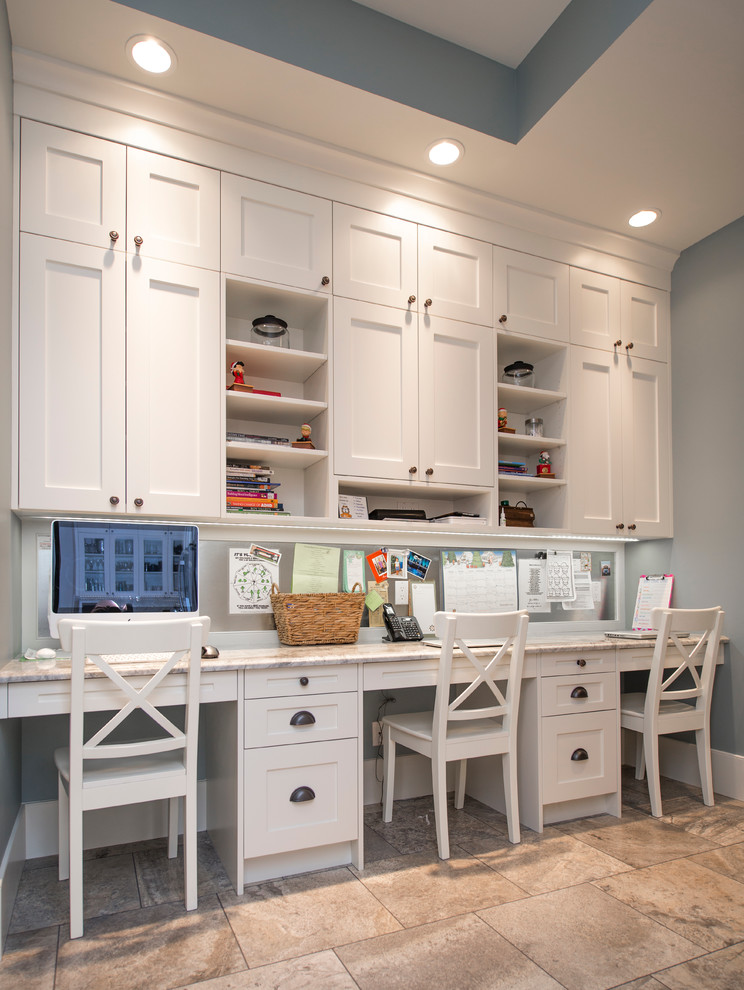 Example of a mid-sized transitional built-in desk ceramic tile study room design in Calgary with gray walls and no fireplace