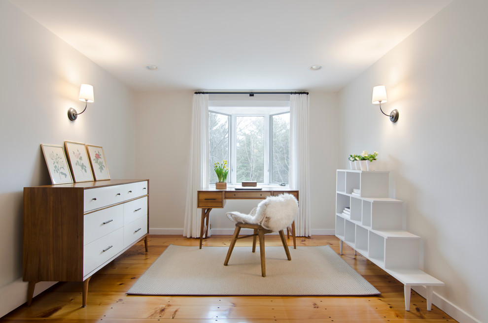 Small minimalist freestanding desk light wood floor home office photo in Boston with gray walls and no fireplace