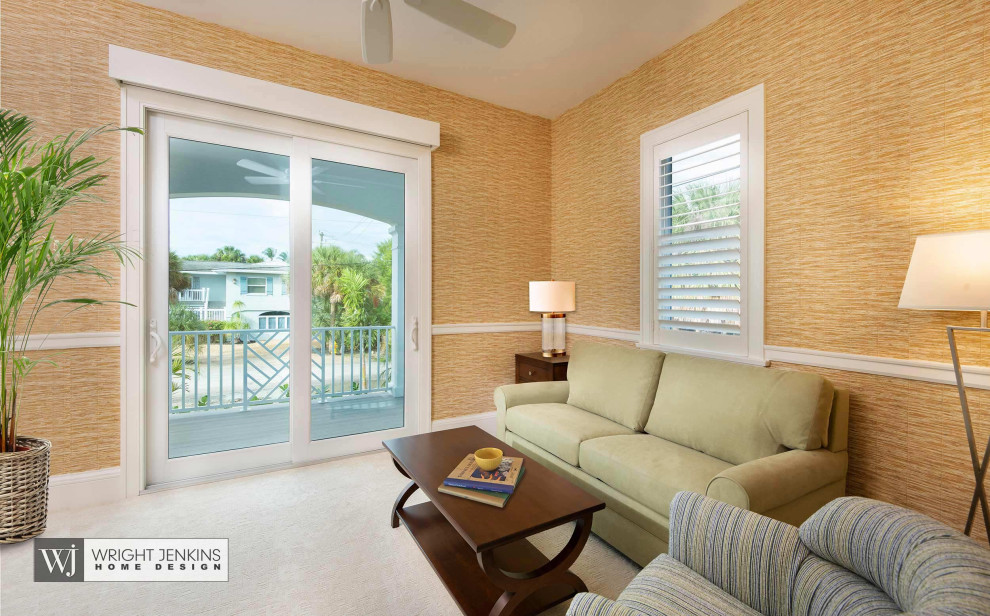 Medium sized beach style study in Tampa with beige walls, carpet, no fireplace, a freestanding desk and beige floors.