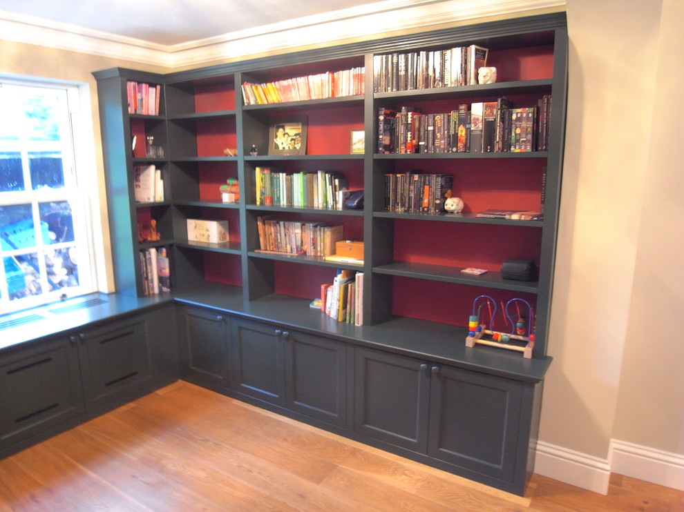 Small elegant light wood floor home office library photo in Essex with beige walls