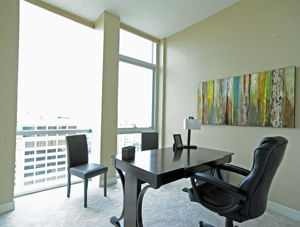 Example of a small trendy freestanding desk study room design in Dallas with beige walls