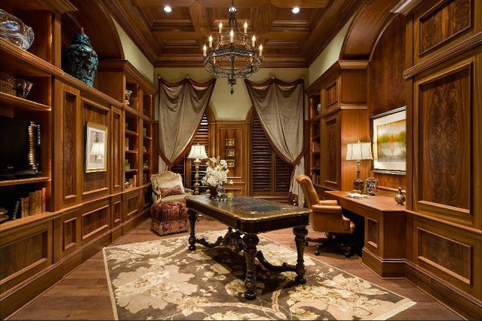 Design ideas for a classic study in Orlando with brown walls, medium hardwood flooring and a freestanding desk.
