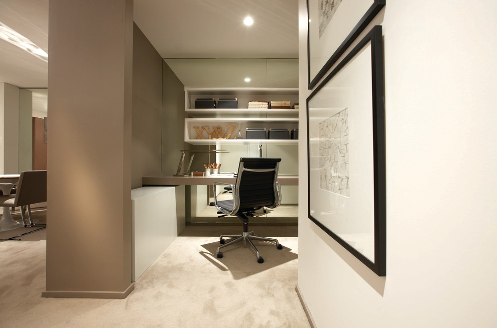 Medium sized contemporary study in Sydney with beige walls, carpet and a built-in desk.