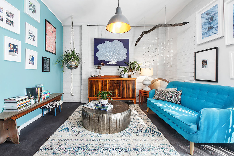 Inspiration for a medium sized eclectic home studio in Melbourne with white walls, concrete flooring and black floors.