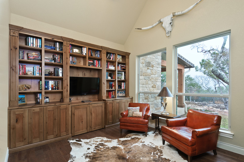 Inspiration for a mid-sized farmhouse freestanding desk dark wood floor study room remodel in Austin with beige walls and no fireplace