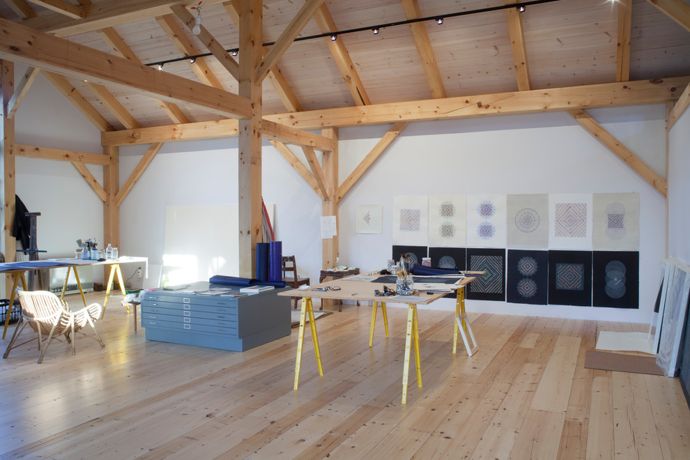Home studio - rustic freestanding desk medium tone wood floor home studio idea in Portland Maine with white walls